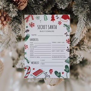 May include: A Secret Santa questionnaire with festive Christmas-themed illustrations. The white paper features sections for favorites, a wishlist, and things to avoid, with red, green, and white decorative elements.