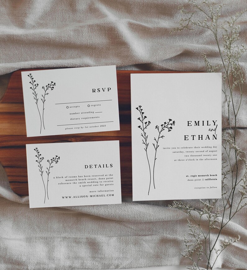 May include: Wedding invitation suite with a minimalist design featuring a floral motif. The invitation card has the names "Emily and Ethan" and details about the wedding ceremony and reception. The RSVP card includes space for guests to indicate their attendance and dietary requirements. The details card provides information about the wedding venue and a special rate for guests.