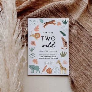 May include: A white invitation card with a jungle theme. The card features a colourful illustration of animals, leaves, and geometric shapes. The text on the card reads "Sarah is Two Wild" and includes details about a birthday party.