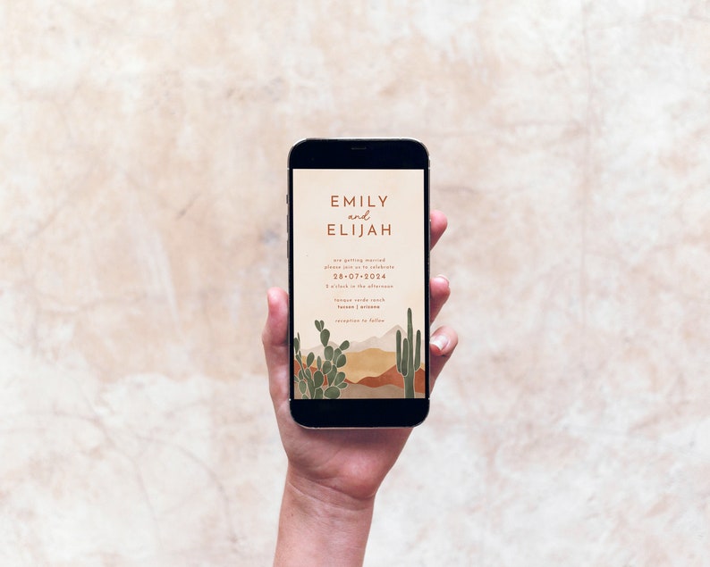 May include: A mobile phone screen displaying a wedding invitation with a desert landscape background. The invitation reads "Emily and Elijah are getting married, please join us to celebrate 28-07-2024 at 2 o'clock in the afternoon."