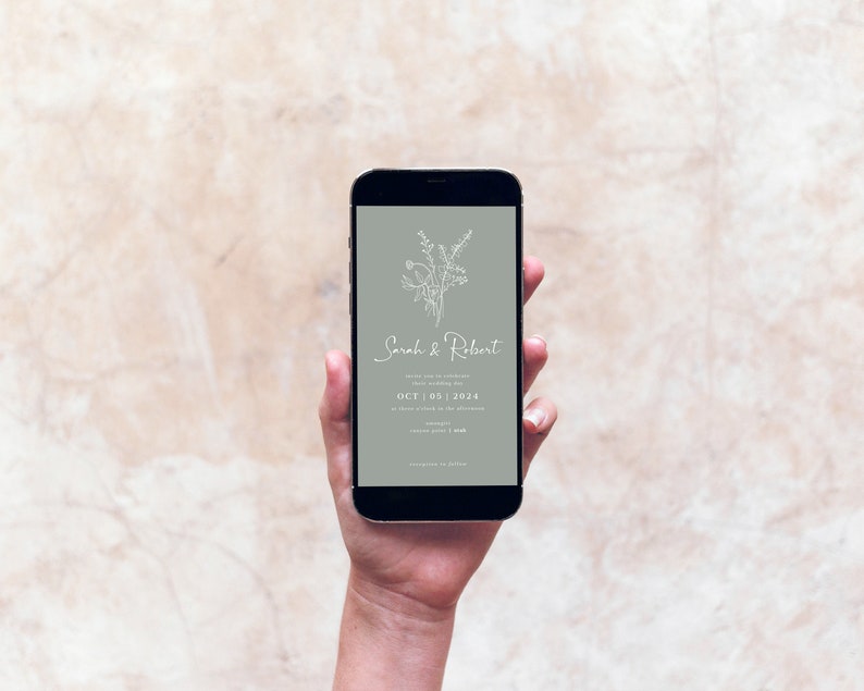 May include: A smartphone displaying a wedding invitation with a floral design and the text "Sarah & Robert" and "OCT. 05. 2024".