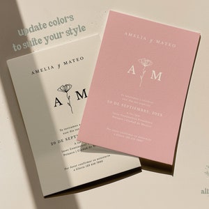 K&ouml;nnte beinhalten: Eine Hochzeitseinladung mit rosa Hintergrund und wei&szlig;em Text. Die Einladung lautet "Amelia y Mateo" und enth&auml;lt das Datum "20 de Septiembre, 2023".