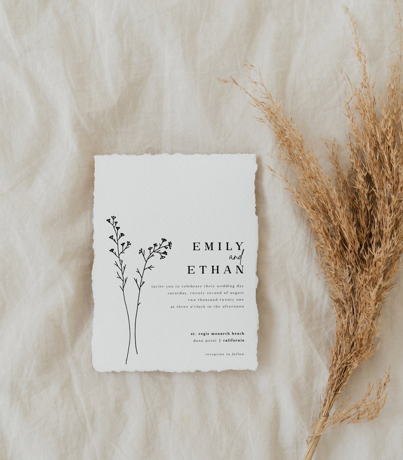 May include: A wedding invitation with a simple design featuring a floral illustration and the names Emily and Ethan. The invitation details the wedding date, time, and location: Saturday, August 22, 2021, at 3:00 PM at St. Regis Monarch Beach in Dana Point, California.