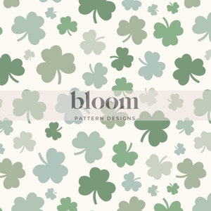 May include: A seamless pattern featuring green shamrocks of various sizes and shades on a white background. The text "bloom PATTERN DESIGNS" is centered at the bottom of the image.
