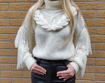 Women's handmade knitted sweater with voluminous braids and fringe