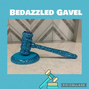 May include: A turquoise bedazzled gavel with a base and handle covered in blue rhinestones. The text "BEDAZZLED GAVEL" is displayed above the gavel. A cartoon gavel illustration is in the lower right corner of the image.