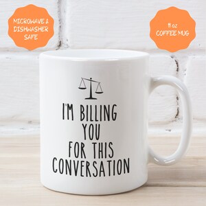 May include: White ceramic coffee mug with a black scale design and the text "I'm Billing You For This Conversation". The mug is 11 oz and microwave and dishwasher safe.