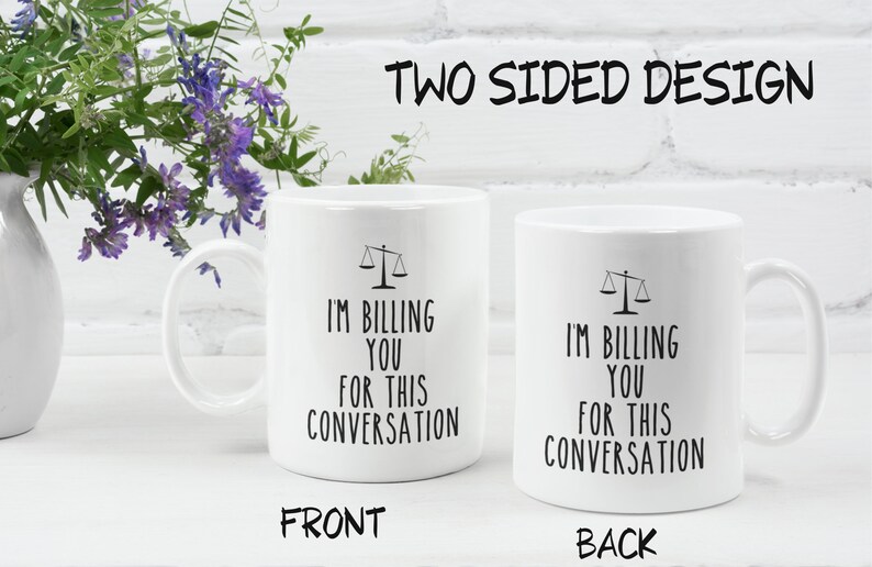 May include: White ceramic mug with a black scale design and the text "I'm billing you for this conversation" on both sides.