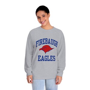 May include: Gray long-sleeve shirt with a blue and red graphic of an eagle with the text "Firebaugh Eagles".