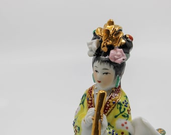 Vintage Geisha meisje met fluit