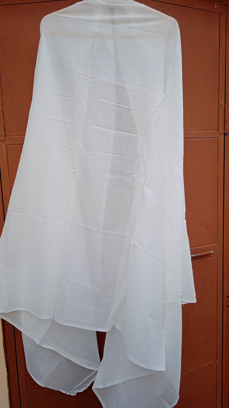 May include: A white sheer fabric scarf hanging on a hanger. The scarf is folded in half and has a smooth texture.