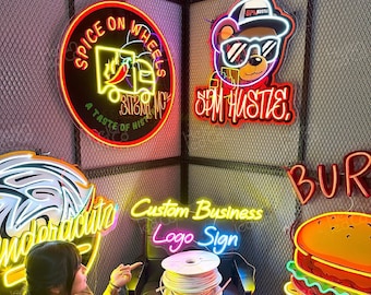 May include: A collection of neon signs with various designs, including a food truck, a bear wearing a hat, a burger, and a palm tree. The signs are illuminated in various colors, including red, yellow, blue, and green. The signs are mounted on a black metal grid wall. The text on the signs reads "Spice on Wheels", "Spam Hustle", "Burger", and "Undercut".