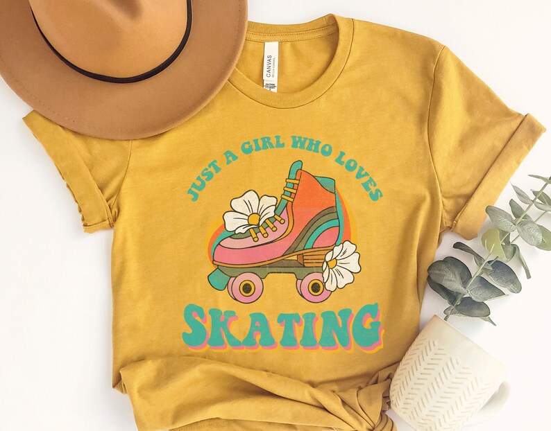 May include: A mustard yellow t-shirt with a retro graphic of a roller skate and the text "Just a girl who loves skating".