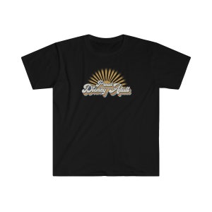 May include: Black t-shirt with a retro-style graphic that says "Proud Disney Adult" with a sunburst behind the text.