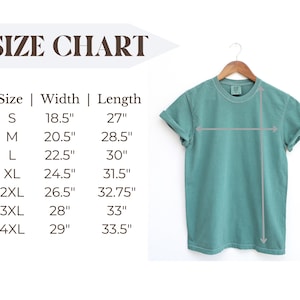 May include: A seafoam green t-shirt hangs on a wooden hanger. The image includes a size chart with measurements in inches for sizes S through 4XL. The chart lists width and length measurements for each size.