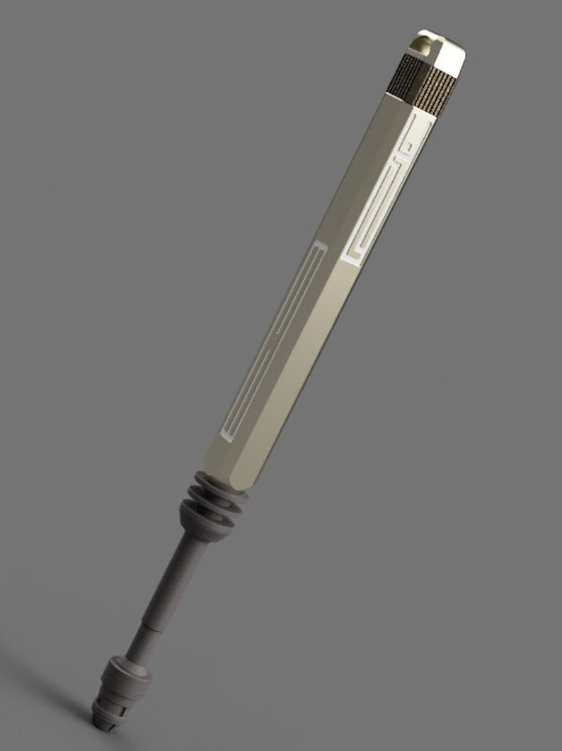 May include: A silver and gray metal tool with a textured handle and a long, thin shaft. The tool has a series of grooves and ridges along the shaft.