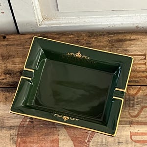 Moet cigar ashtray. Moet et Chandon large cigar ashtray in ceramic in bottle green colour with gold colour detailing . Unused vintage