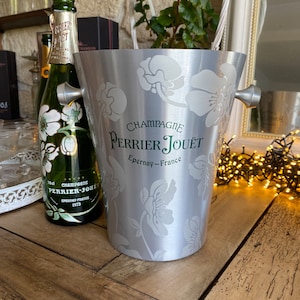Perrier Jouet Champagne cooler featuring the belle époque anemone design. Art deco style handles. A  deep champagne cooler crafted by Vogalu
