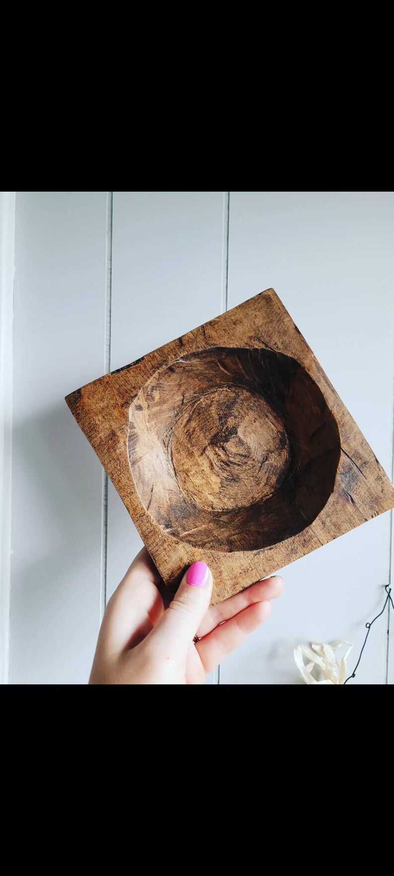 May include: A square wooden bowl with a deep, rounded interior. The bowl is made of dark brown wood with a natural wood grain pattern.