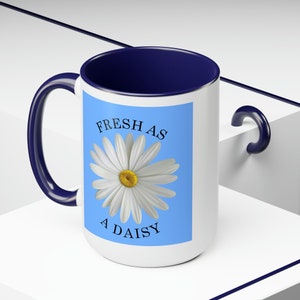 Fresh As A Daisy Floral Coffee Mug, a beautiful white daisy on a blue background really sets it off, and we all want to be fresh as a daisy.