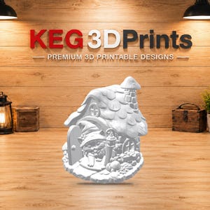 May include: A white 3D printed figurine featuring a small house with a textured roof and a chimney. A cat wearing a pointed hat is positioned in the doorway next to a small lamp post. The base of the figurine is circular and includes detailed stone-like textures.