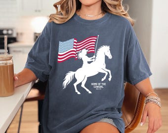 Home of the Cowgirl T-shirt, USA Patriotic Cowgirl Shirt, Western Graphic Tee, 4th of July Cowgirl USA T-Shirt, Comfort Colors, Women's Tee