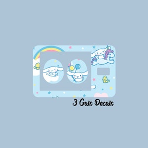 May include: Three cute cartoon dog decals with a rainbow, stars, and clouds on a light blue background. The text "3 Gals Decals" is at the bottom of the image.