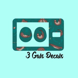 May include: Three round teal blue decals with a white outline featuring a brown otter on a teal blue background with white outlines. The decals are arranged in a row and are labeled "3 Gals Decals".