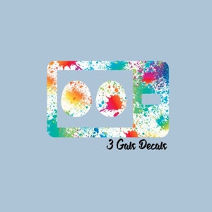 May include: A colorful decal with a white background and two circles. The decal has a paint splatter design and the text "3 Gals Decals".