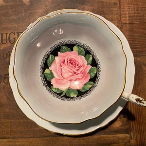 Paragon tea cup one saucer with rose in the center