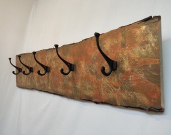 Coat rack in oak with oxidized metal leaf finish