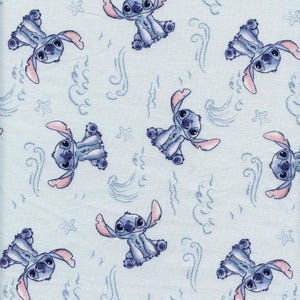 May include: Light blue fabric featuring a repeating pattern of the character Stitch from Lilo & Stitch. The design includes Stitch in various poses, along with stylized waves and star shapes. The overall aesthetic is playful and whimsical.