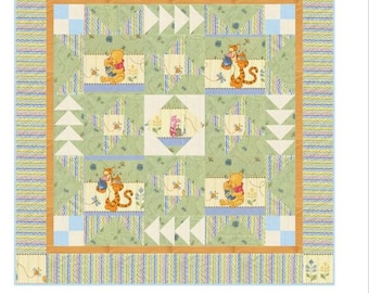 May include: A quilt pattern titled DIAMOND IN THE WOODS, KFK-0002, featuring Winnie the Pooh characters, green fabric blocks, and a striped border. The text indicates a finished size of 46 inches by 46 inches and requires 9.5 inch blocks.