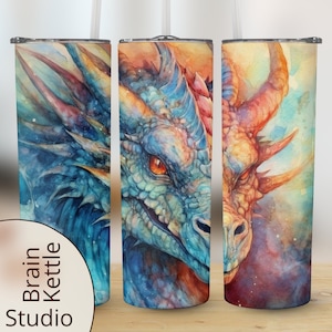 May include: Three stainless steel tumblers featuring a watercolour dragon design. The dragon is blue, green and orange with a white background. The tumblers are a great way to keep your drinks cold or hot.