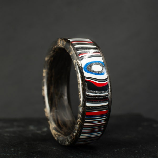 Handcrafted carbon fibre and fordite ring