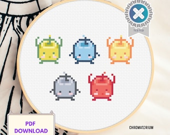 May include: Cross stitch pattern featuring five pixelated characters with different colors and expressions. The characters are yellow, blue, gray, red, and orange. The pattern is displayed on a white embroidery hoop.