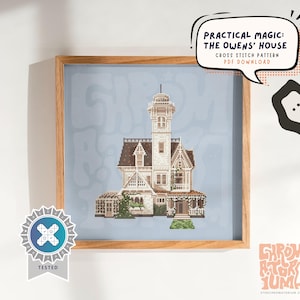 May include: Cross-stitch pattern of the Owens' House from Practical Magic, framed in a wooden frame. The house is white with a brown roof and intricate details. Text in a speech bubble reads "Practical Magic: The Owens' House Cross Stitch Pattern PDF Download."