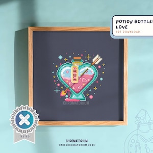 May include: A cross-stitch pattern of a heart-shaped potion bottle with a pink liquid and a pink heart inside. The bottle is labelled "Amour" and has a blue and green design. The pattern is surrounded by stars and hearts.