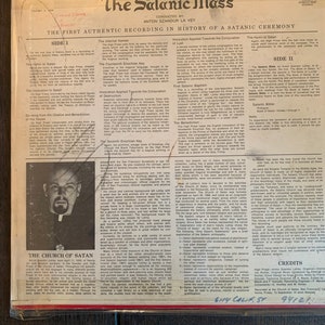 May include: A black and white photo of Anton Szandor LaVey, the founder of the Church of Satan, on the cover of a vinyl record titled "The Satanic Mass". The record cover includes text describing the contents of the record, including the "Hymn to Satan", "Invocation to Satan", and "The Satanic Bible".