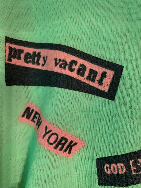 Sex Pistols T-Shirt - NMTB Original Album Official Unisex T-Shirt In Green