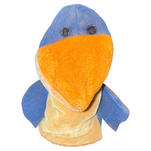 May include: A plush bird puppet with a blue head and wings, an orange beak, and a yellow chest. The puppet has two small black eyes and is made of soft, velvety fabric. The bird puppet is designed to fit over a hand for play.