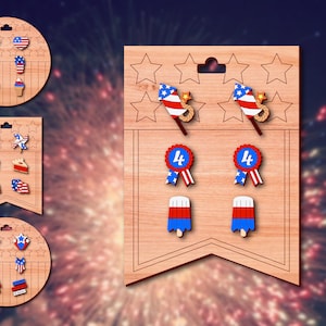 May include: A set of six pairs of patriotic themed earrings on a wooden display card. The earrings feature designs such as fireworks, ice cream cones, stars, and pie slices. The earrings are red, white, and blue.