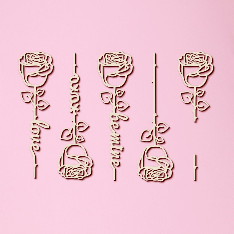 May include: Four wooden rose cutouts with the words "love", "always", "be mine", and a blank cutout. The roses are white and the words are in a cursive font.