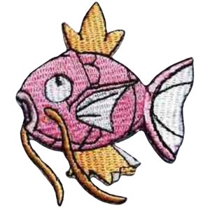 May include: A pink and white embroidered patch of a cartoon fish with a long brown snout and a yellow crown. The fish has a white fin and a yellow fin.
