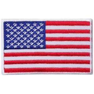 May include: A red, white, and blue embroidered American flag patch. The patch is rectangular and has a white border.