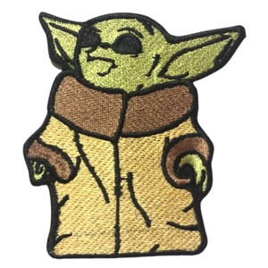 May include: Embroidered patch featuring a green character with large ears, wearing sunglasses and a brown and yellow coat.