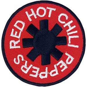 May include: Red Hot Chili Peppers logo patch with a red background, a white outline, and a black starburst in the center.