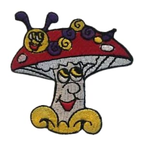 May include: A red and white mushroom with a smiling face and yellow eyes. A purple and yellow caterpillar is on top of the mushroom.