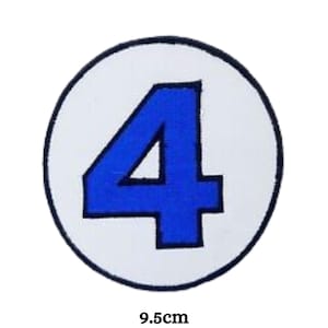May include: A white circle with a blue number 4 in the centre. The circle is 9.5 cm in diameter.