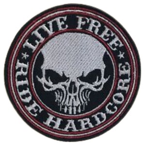 May include: Black and white embroidered patch with a skull in the centre and the text "Ride Free Hardcore" around the skull.